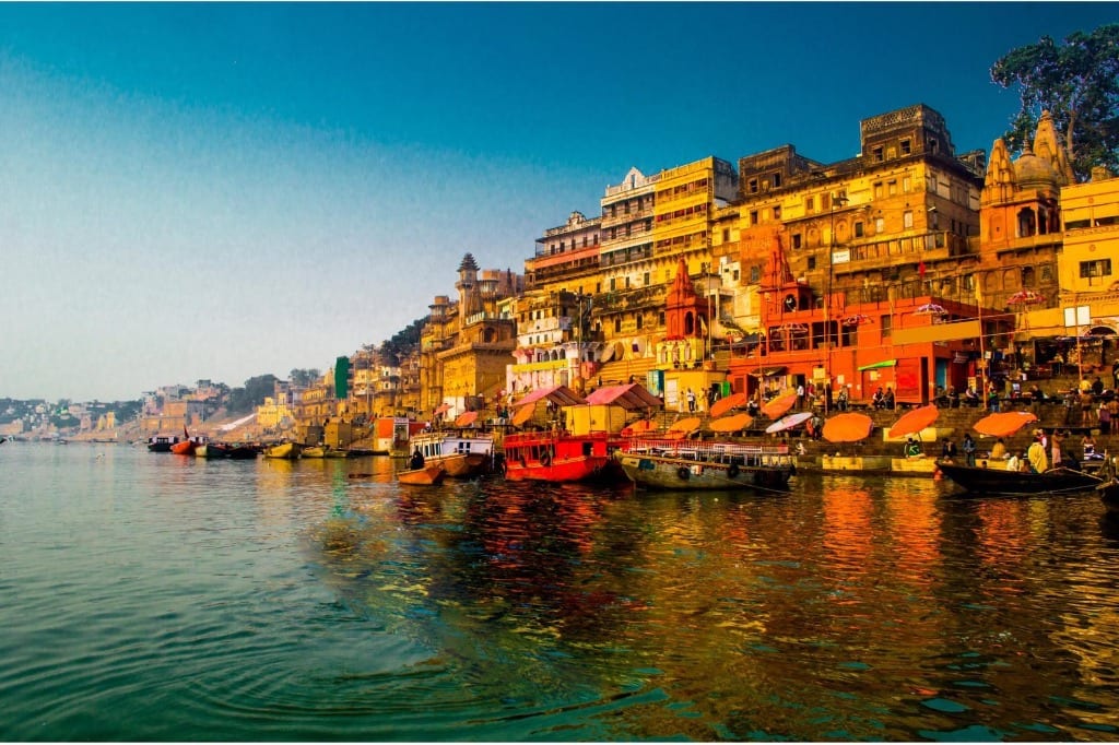 Vibrant Varanasi heritage ghats and clear river reflection