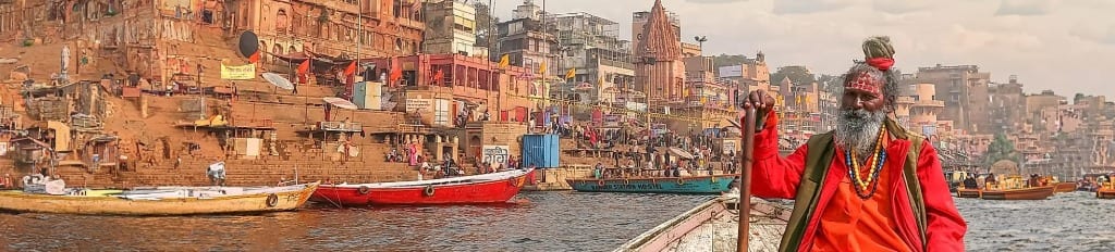 Sadhu on sacred boat in Varanasi