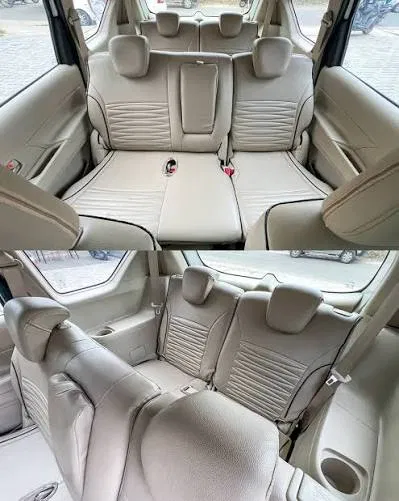 Maruti Suzuki Ertiga interior cabin showing 6 comfortable passenger seats with roof AC vents