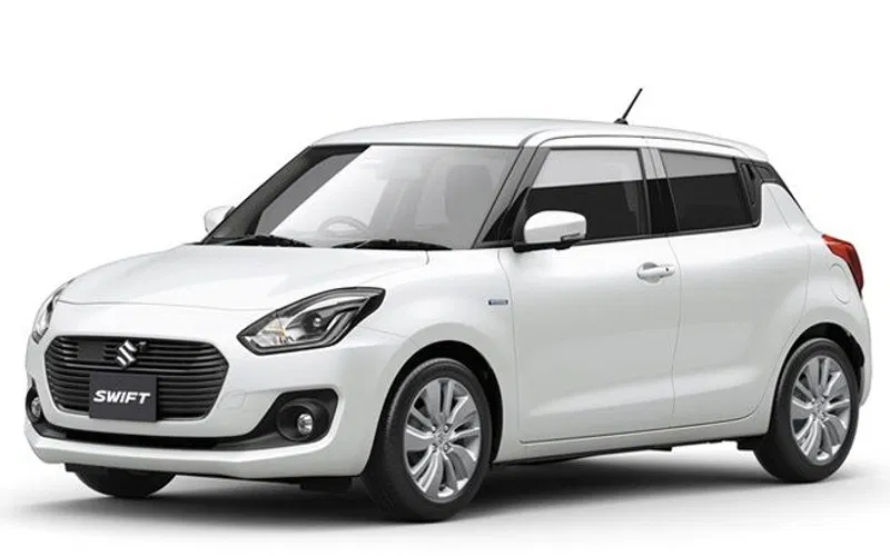 Maruti Suzuki Swift Dzire white tourist cab exterior Varanasi