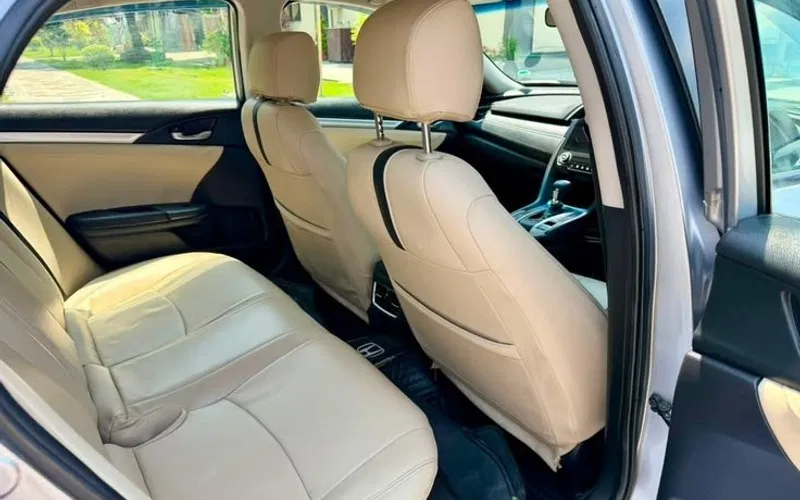 Maruti Swift Dzire comfortable beige leather passenger cabin with rear legroom