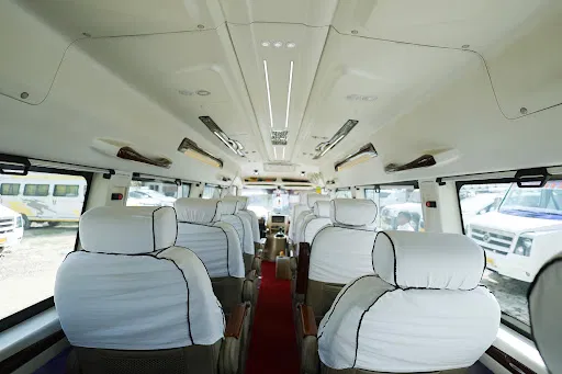 20 seater clean Tempo Traveller interior cabin with headrest covers